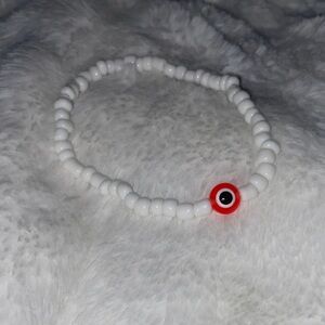 Handmade White Beaded Bracelet with Red Accent